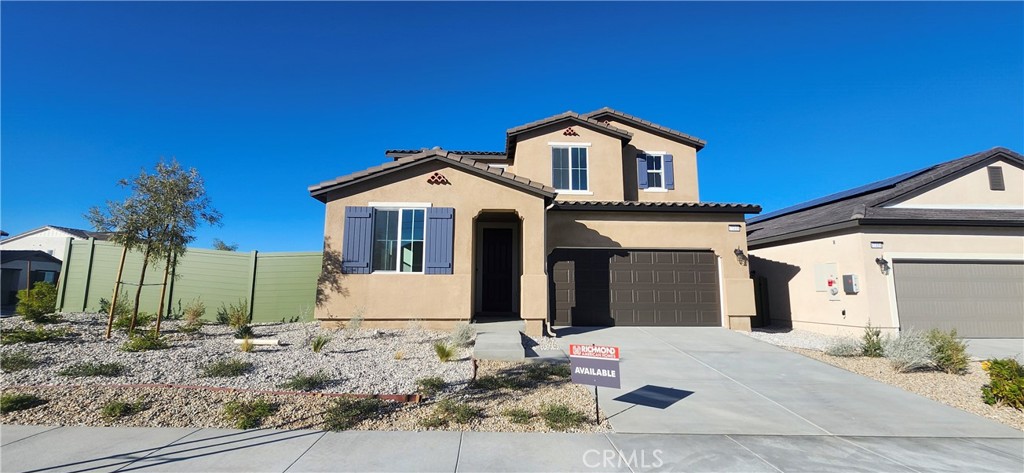 17448 Marion Mountain Hesperia, CA 92345 - Photo 1 of 12 a front view of a house with a yard