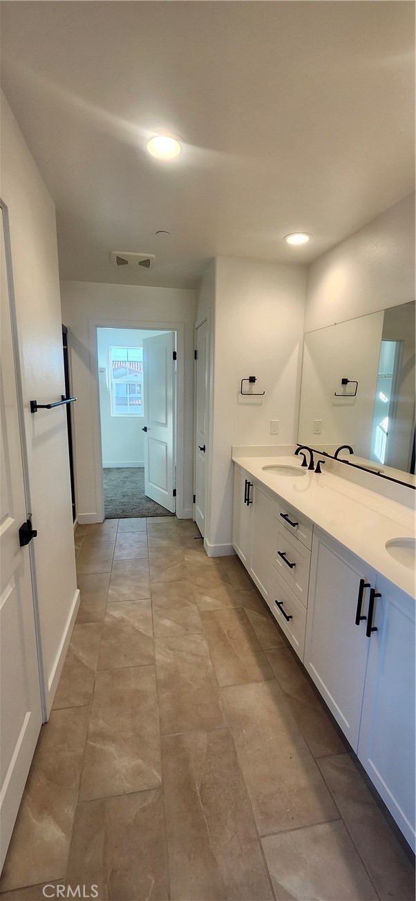 17448 Marion Mountain Hesperia, CA 92345 - Photo 9 of 12 a large white kitchen with a sink