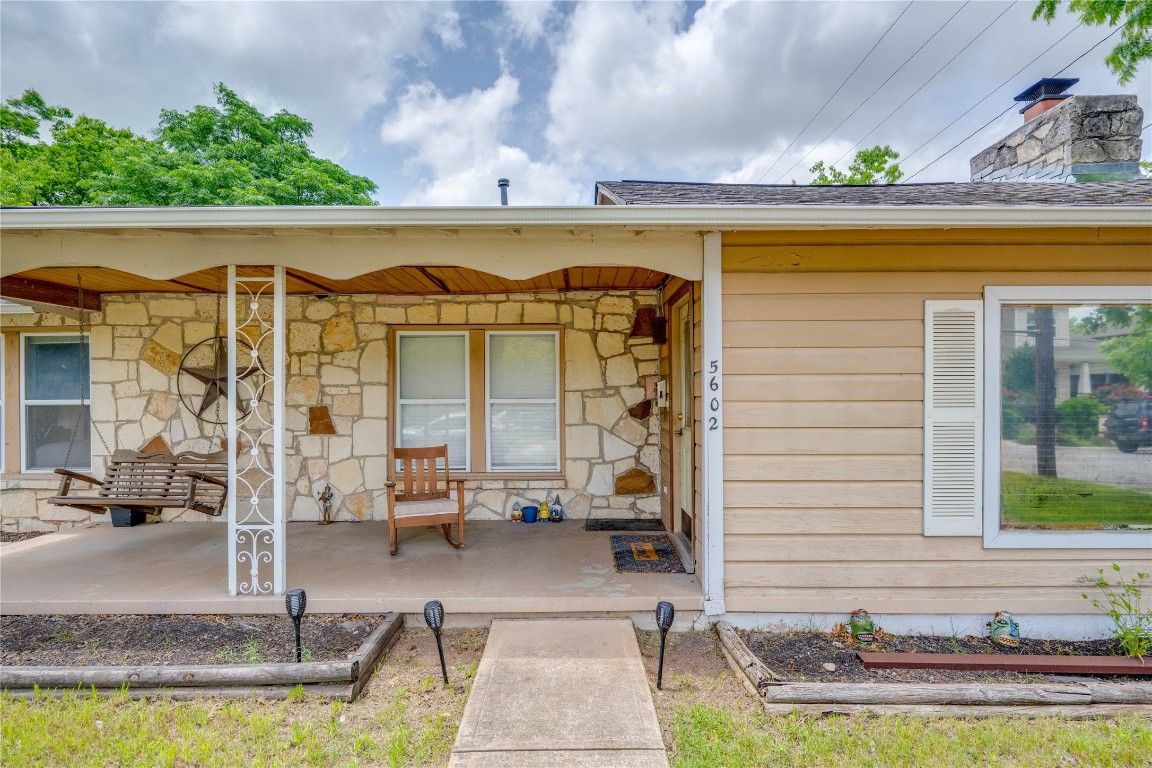 5602 Roosevelt Avenue Austin, TX 78756 - Photo 1 of 22 a view of a patio with table and chairs with wooden floor and plants