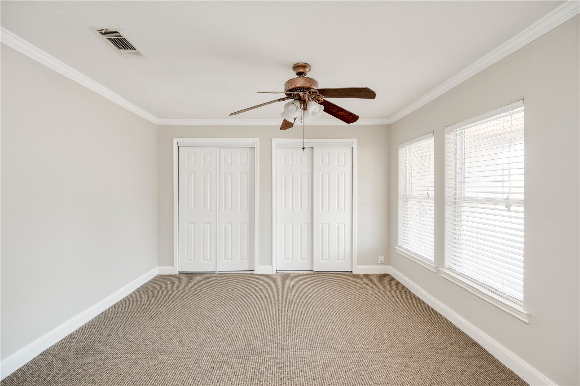 5602 Roosevelt Avenue Austin, TX 78756 - Photo 11 of 22 a view of empty room with window and ceiling fan