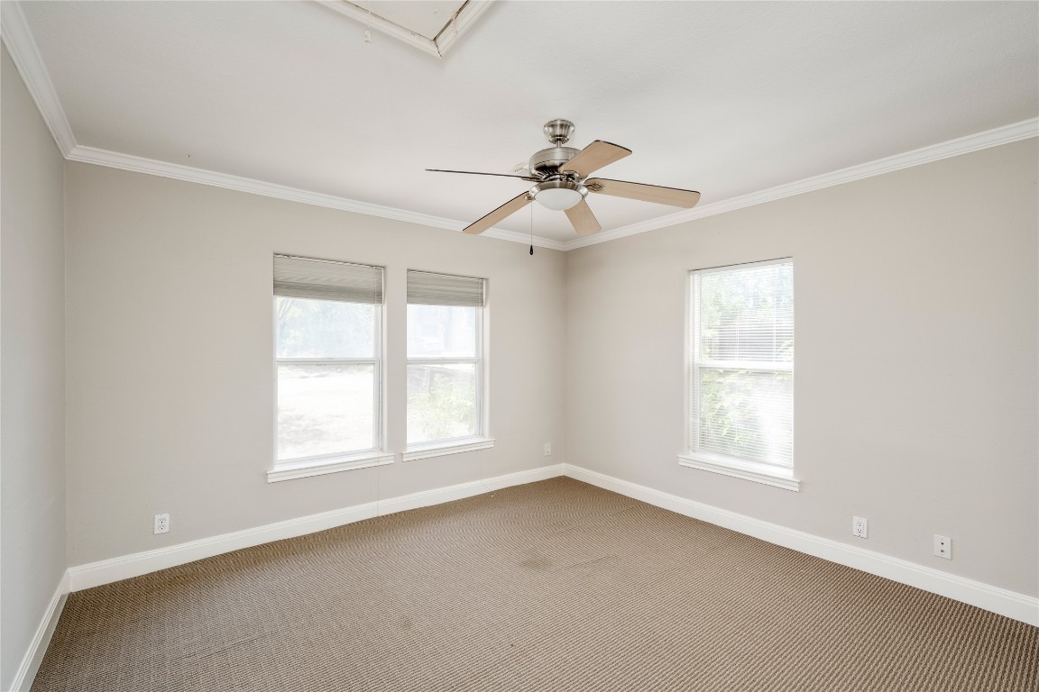 5602 Roosevelt Avenue Austin, TX 78756 - Photo 12 of 22 an empty room with a window and a fan