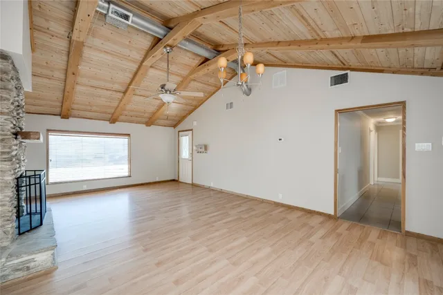 a view of a livingroom with wooden floor