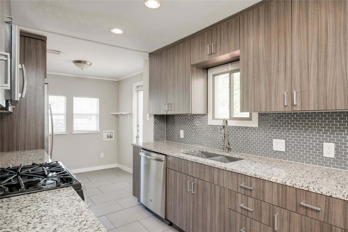 5602 Roosevelt Avenue Austin, TX 78756 - Photo 8 of 22 a kitchen with a sink stove and cabinets