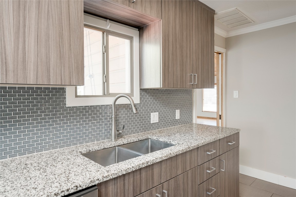 5602 Roosevelt Avenue Austin, TX 78756 - Photo 10 of 22 a kitchen with a sink cabinets and window