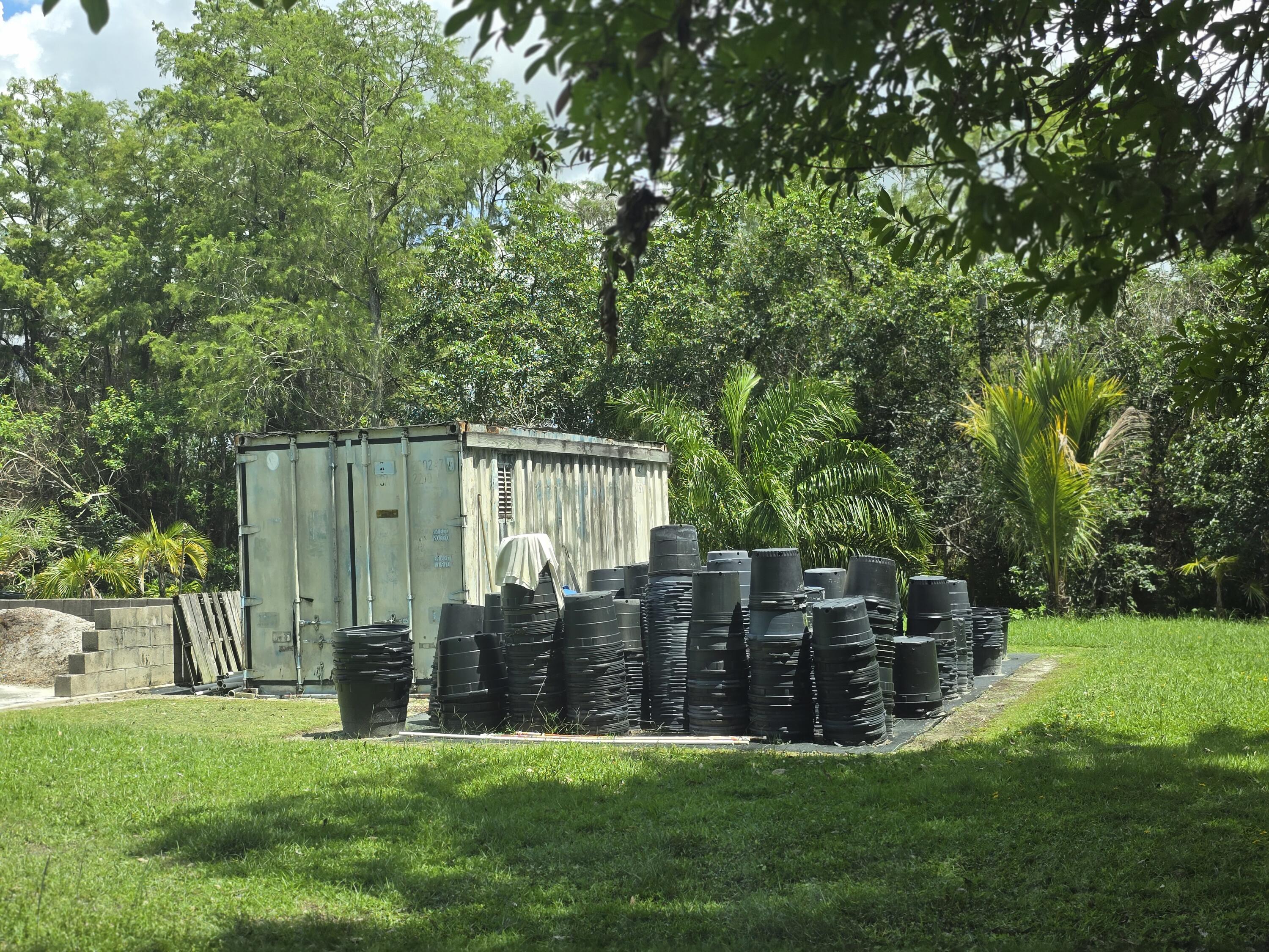 0 B Road Loxahatchee, FL 33470 - Photo 19 of 24 a view of a house with backyard and garden