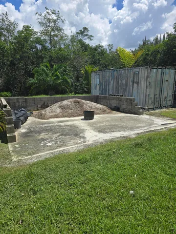 a swimming pool with wooden fence