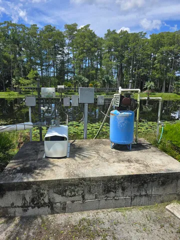 a view of a yard with a table and chair