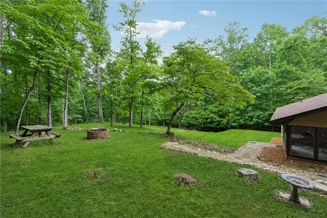 a view of a backyard with sitting area