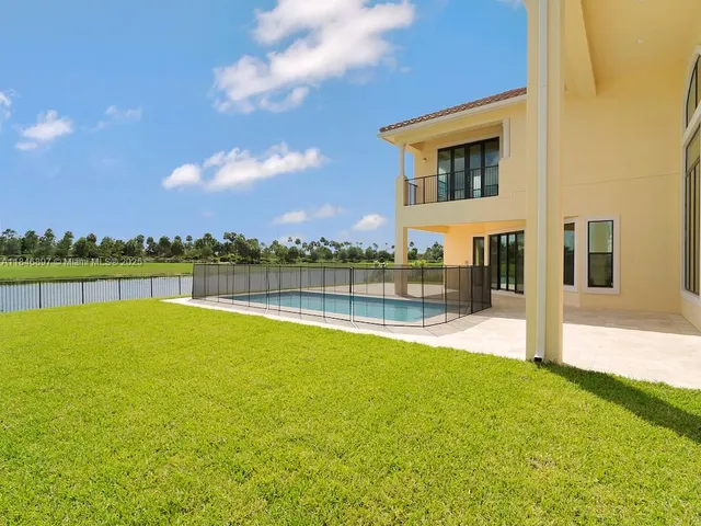 a view of a floor to ceiling window and an outdoor view