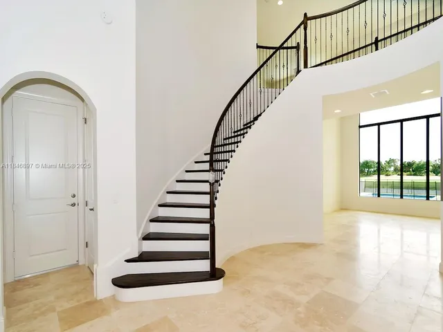 a view of an empty room with a balcony