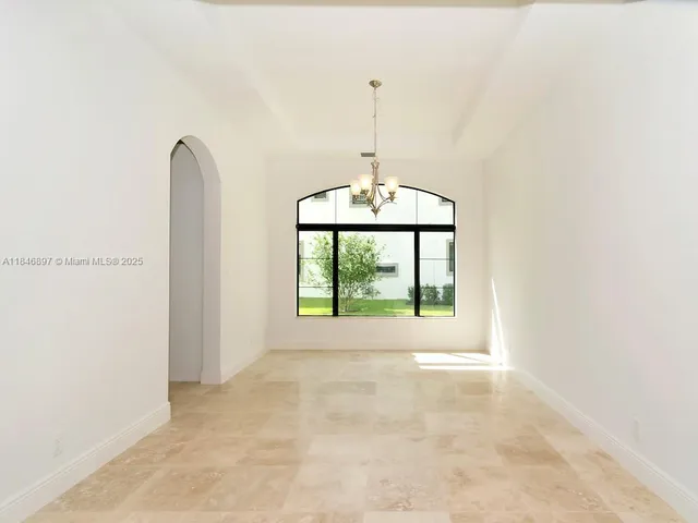 a view of kitchen with furniture and window