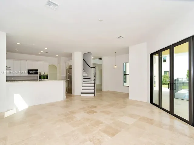 a kitchen with granite countertop a stove and a sink