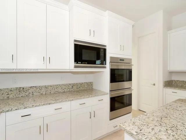 a bathroom with a sink a toilet and bathtub