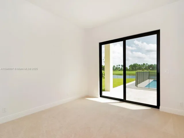 a view of a lake with houses in the back