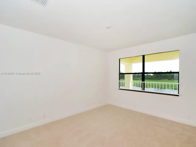 a spacious bathroom with a granite countertop sink a toilet and shower