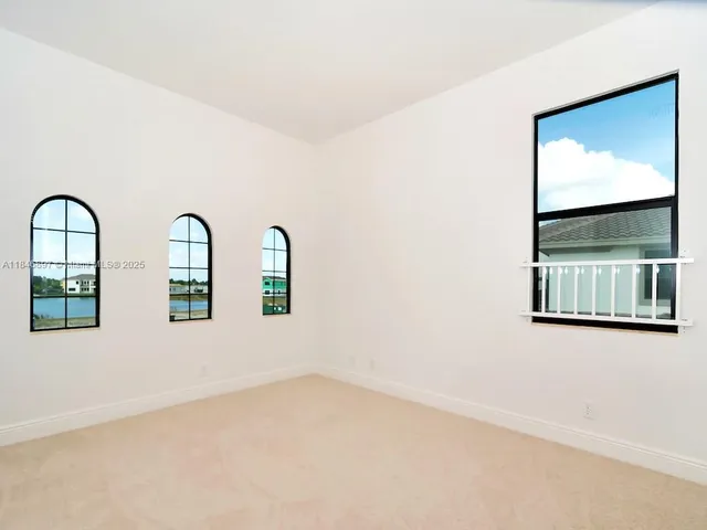 a view of an empty room with an entryway