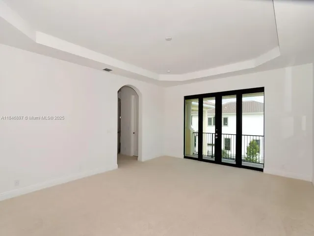 a white toilet sitting next to a bath tub