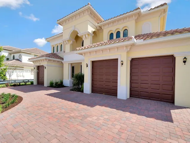 a view of a white house with a outdoor space