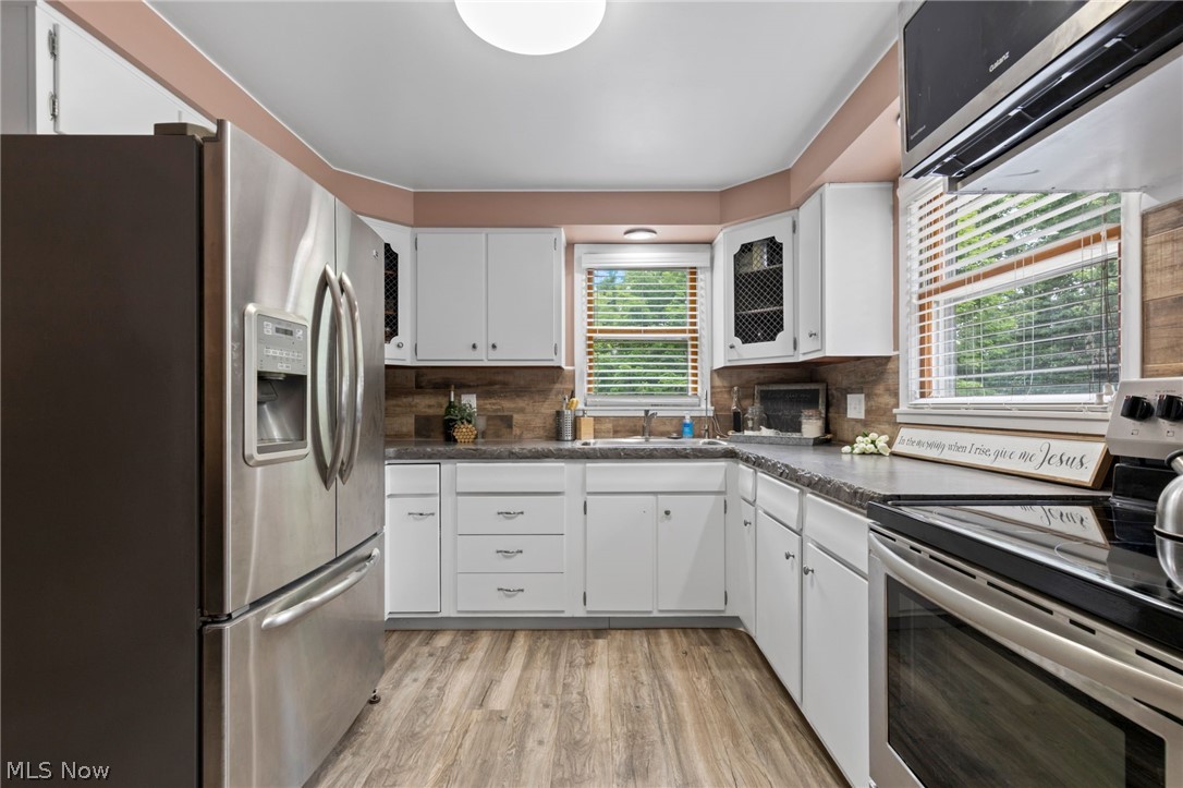 3833 Bellville North Road Bellville, OH 44813 - Photo 6 of 24 Kitchen featuring stainless steel appliances, tasteful backsplash, and a healthy amount of sunlight
