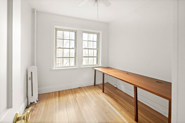 a room with window and a wooden floor