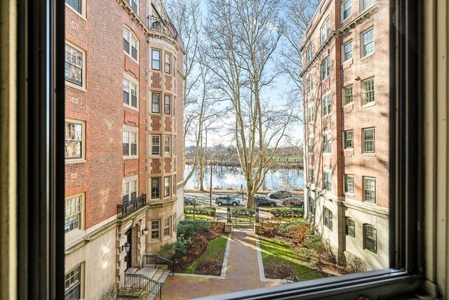 a view of a balcony with wooden floor and fence