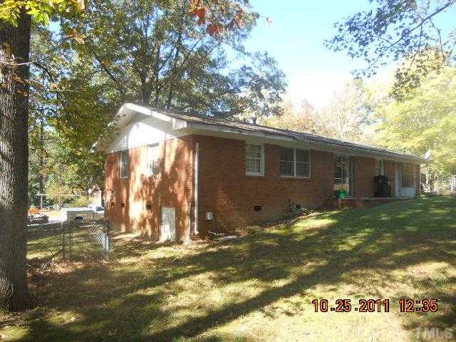 501 Dacian Road Raleigh, NC 27610 - Photo 3 of 3 a view of a house with backyard and trees