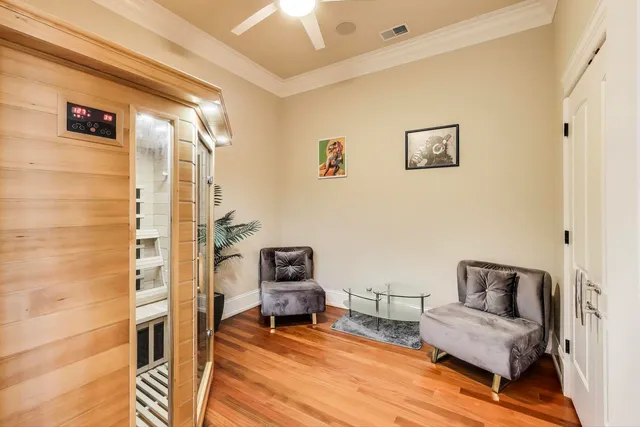 a living room with furniture and a mirror