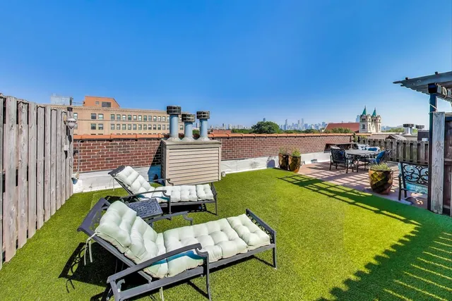 a view of a swimming pool with lounge chairs