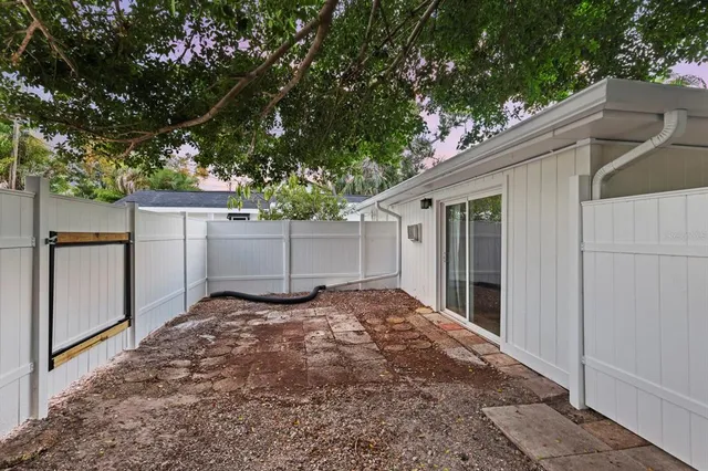 a backyard of a house with garage