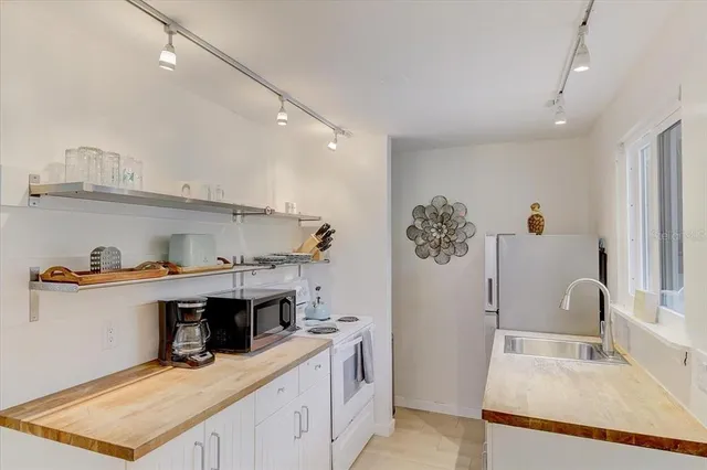 a kitchen with a sink and cabinets