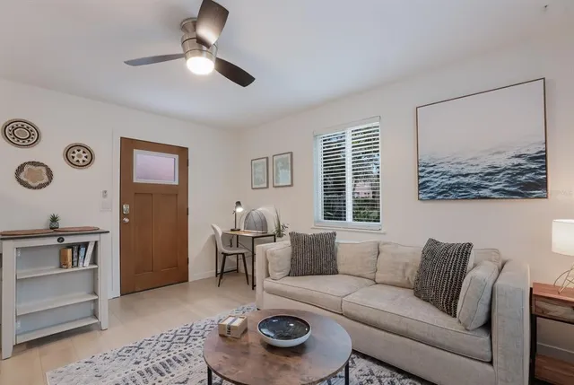 a living room with furniture and a large window