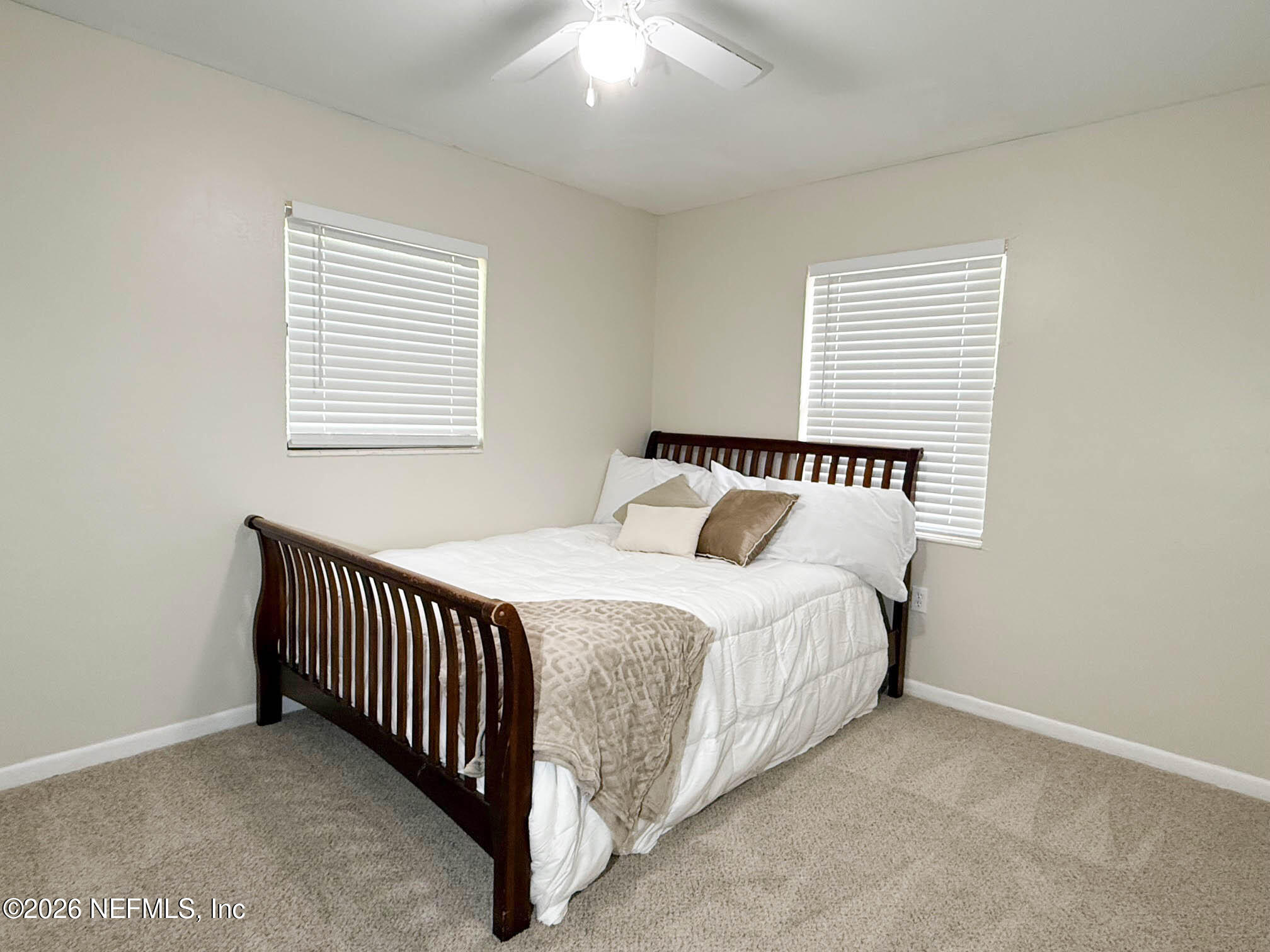 22620 Southeast Hawthorne Road Hawthorne, FL 32640 - Photo 14 of 28 a bedroom with a bed and window