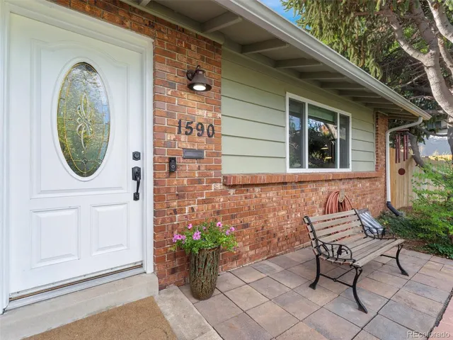 a view of a two chairs in the balcony