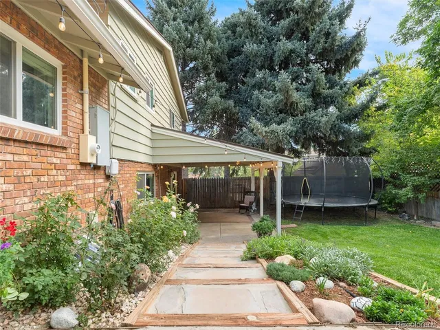 a view of a house with garden and plants