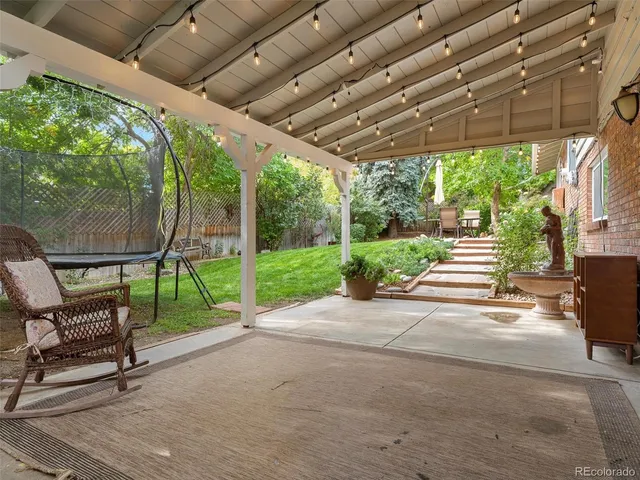 a view of a chair and table in the patio