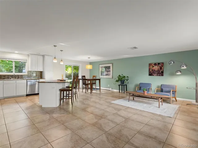 a view of kitchen with furniture and breakfast area