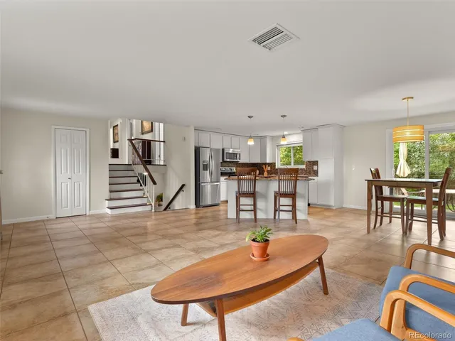 a living room with furniture and a table
