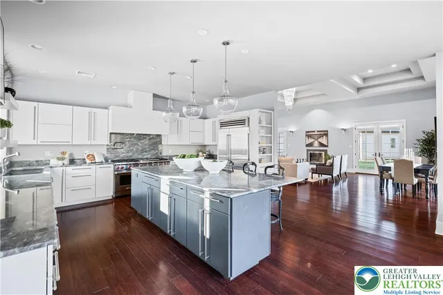 a dining room with furniture window front door and wooden floor