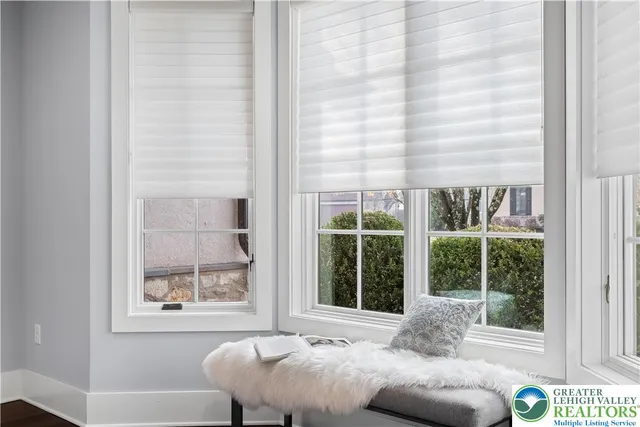 a bathroom with a granite countertop sink mirror vanity and toilet