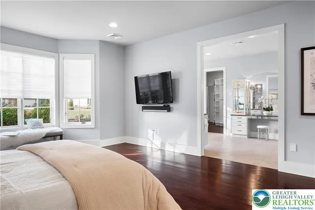 a bathroom with a sink a vanity and a window