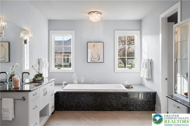 a bathroom with a toilet a sink and a window