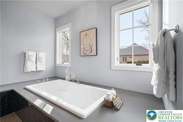 a living room with furniture flat screen tv and wooden floor