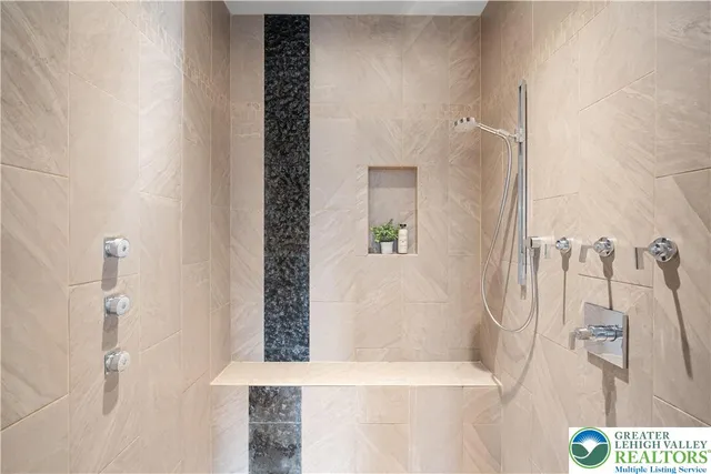 a bathroom with a shower and a sink