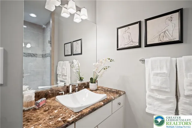 a view of a house with a big yard and a large tree