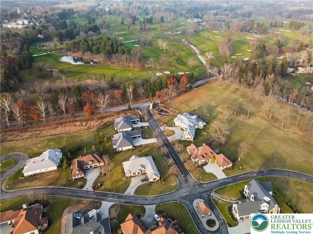 a living room with furniture fireplace and a large window