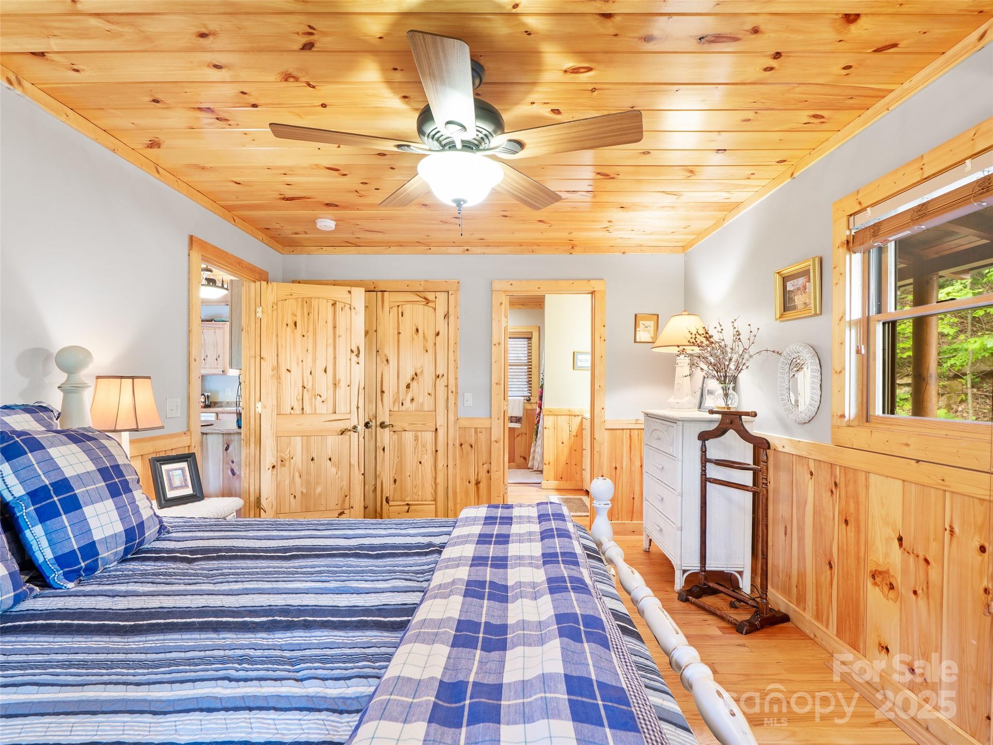 198 Grace Ridge Road Bakersville, NC 28705 - Photo 11 of 27 a bedroom with a bed and wooden floor