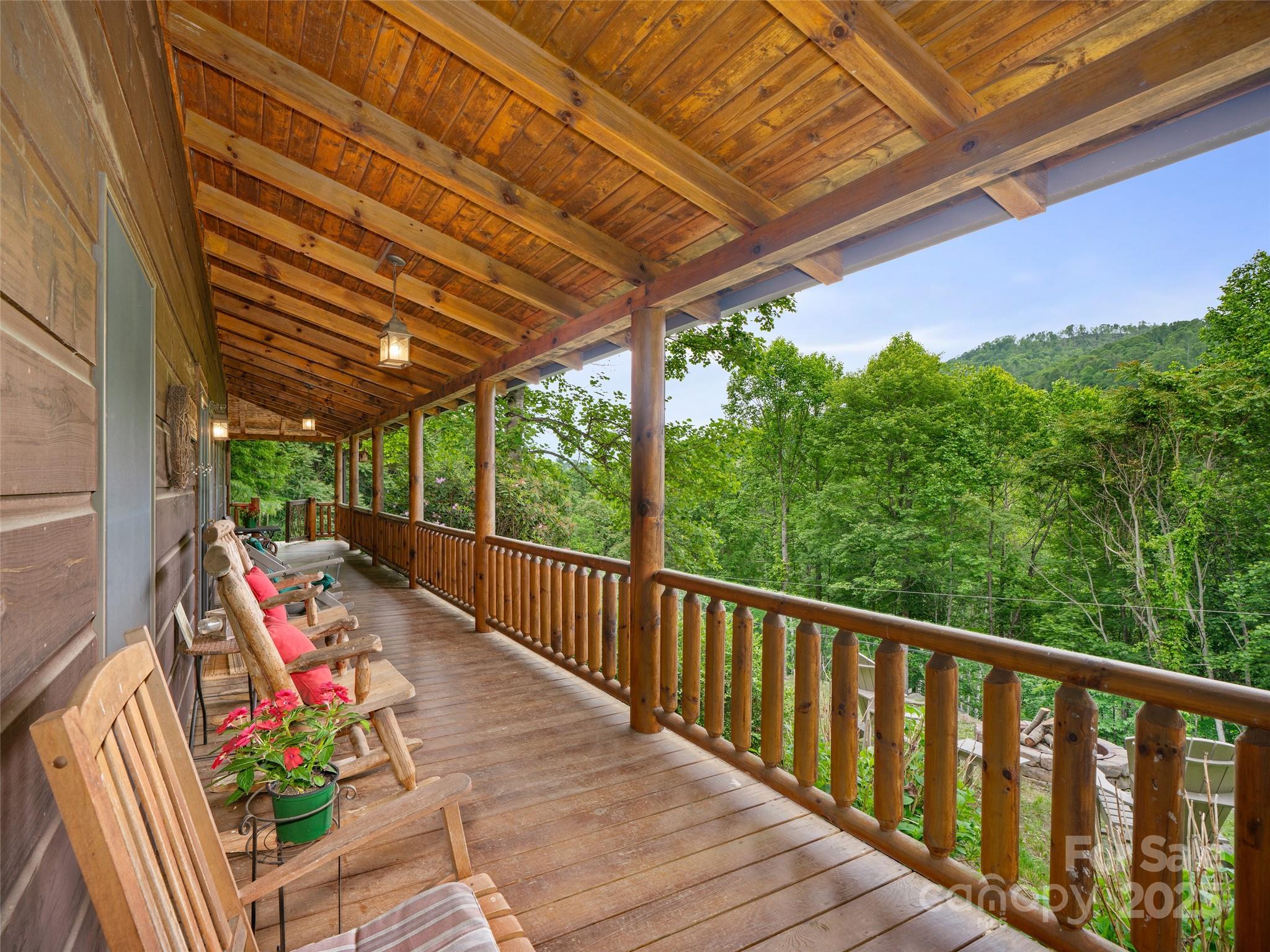 198 Grace Ridge Road Bakersville, NC 28705 - Photo 17 of 27 a view of a patio with wooden floor