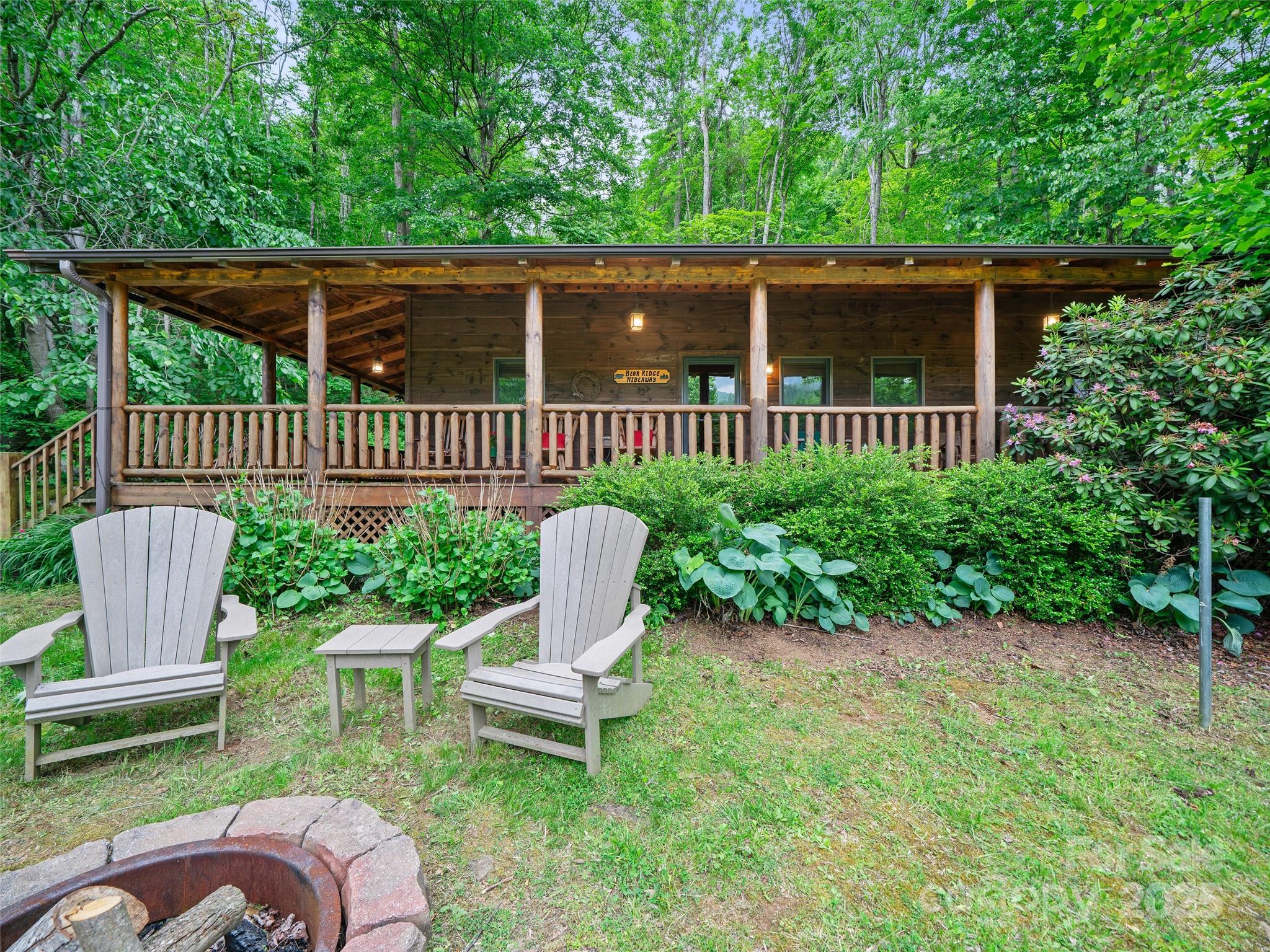 198 Grace Ridge Road Bakersville, NC 28705 - Photo 19 of 27 a view of a chair and table in the backyard