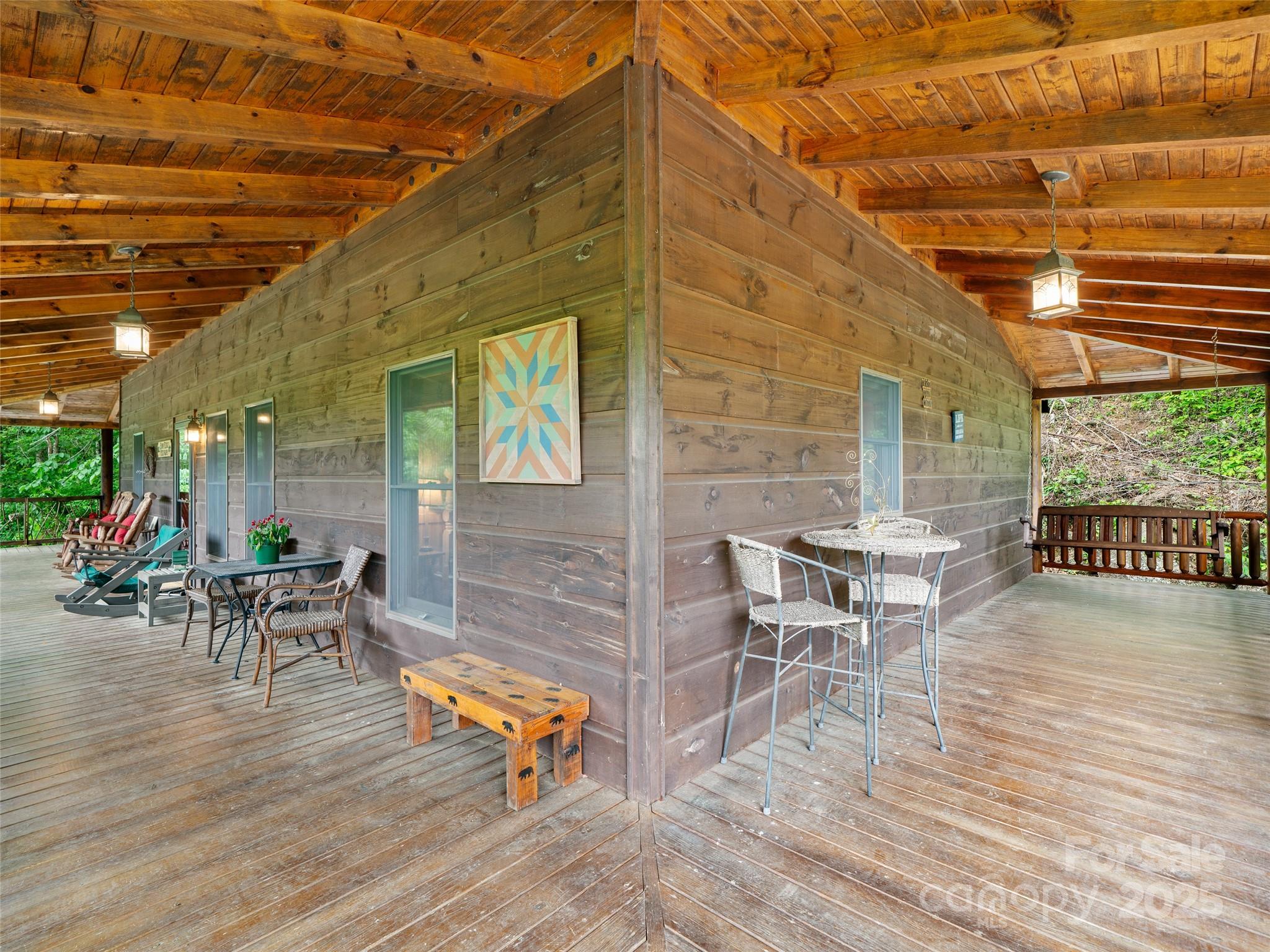 198 Grace Ridge Road Bakersville, NC 28705 - Photo 20 of 27 a backyard of a house with table and chairs