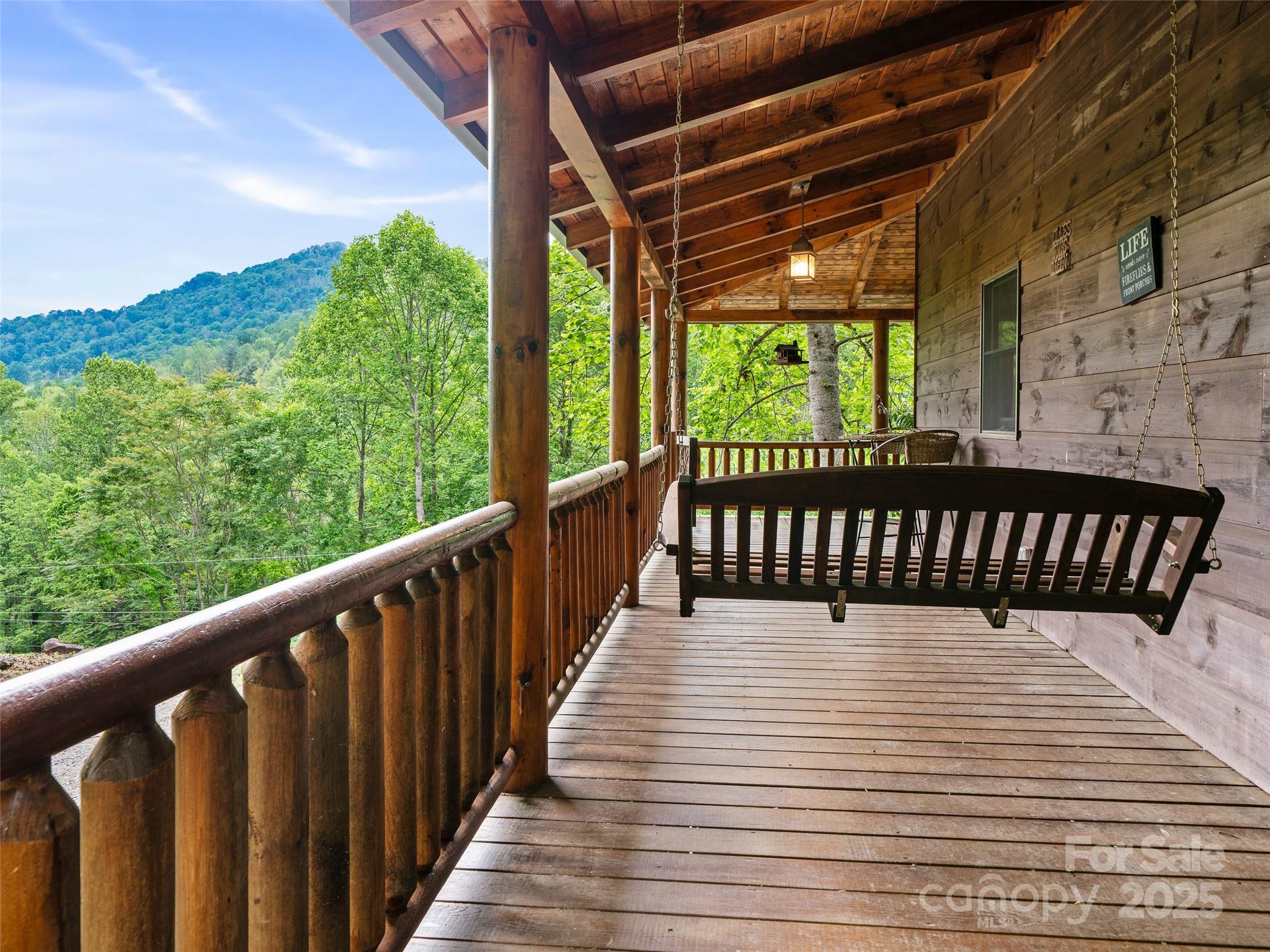 198 Grace Ridge Road Bakersville, NC 28705 - Photo 2 of 27 a balcony with wooden floor